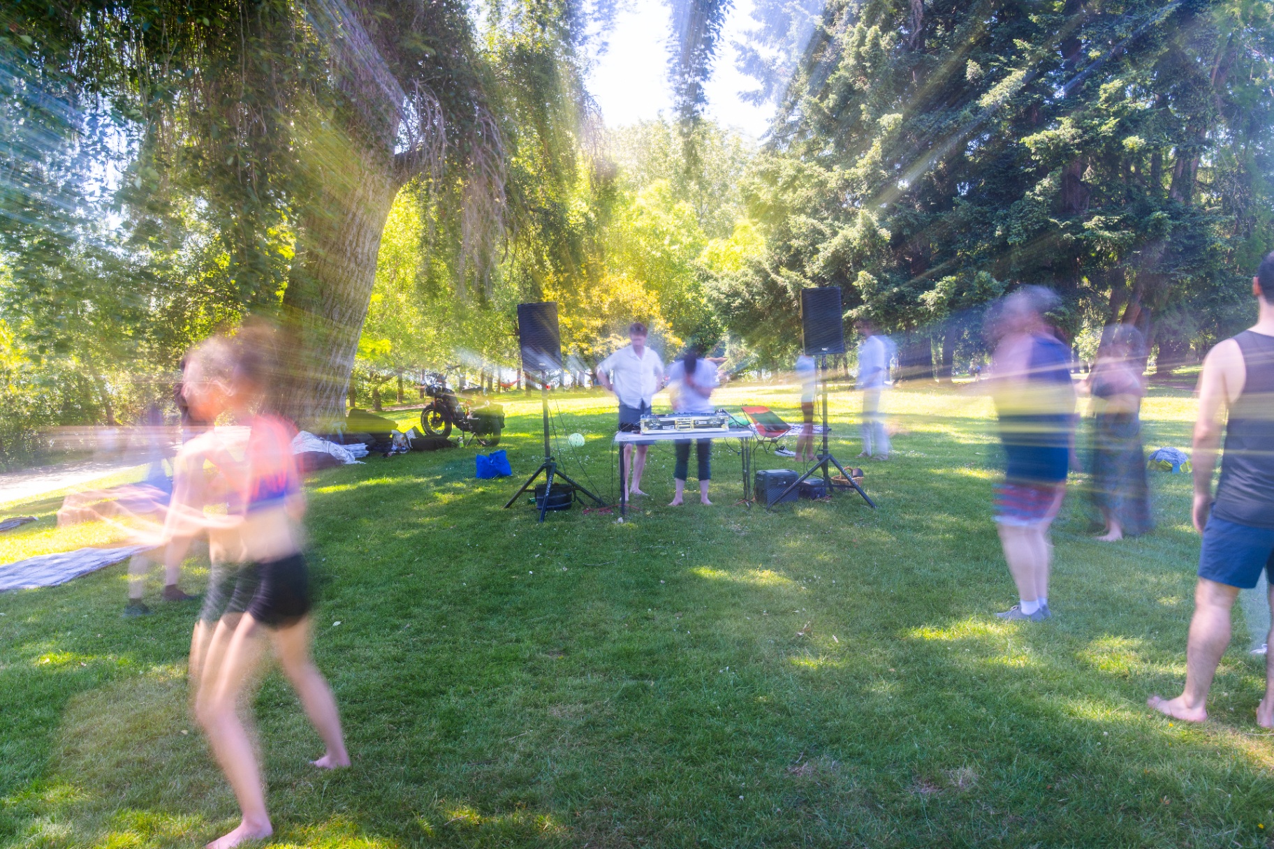 Dancers in motion with sun beams streaming through