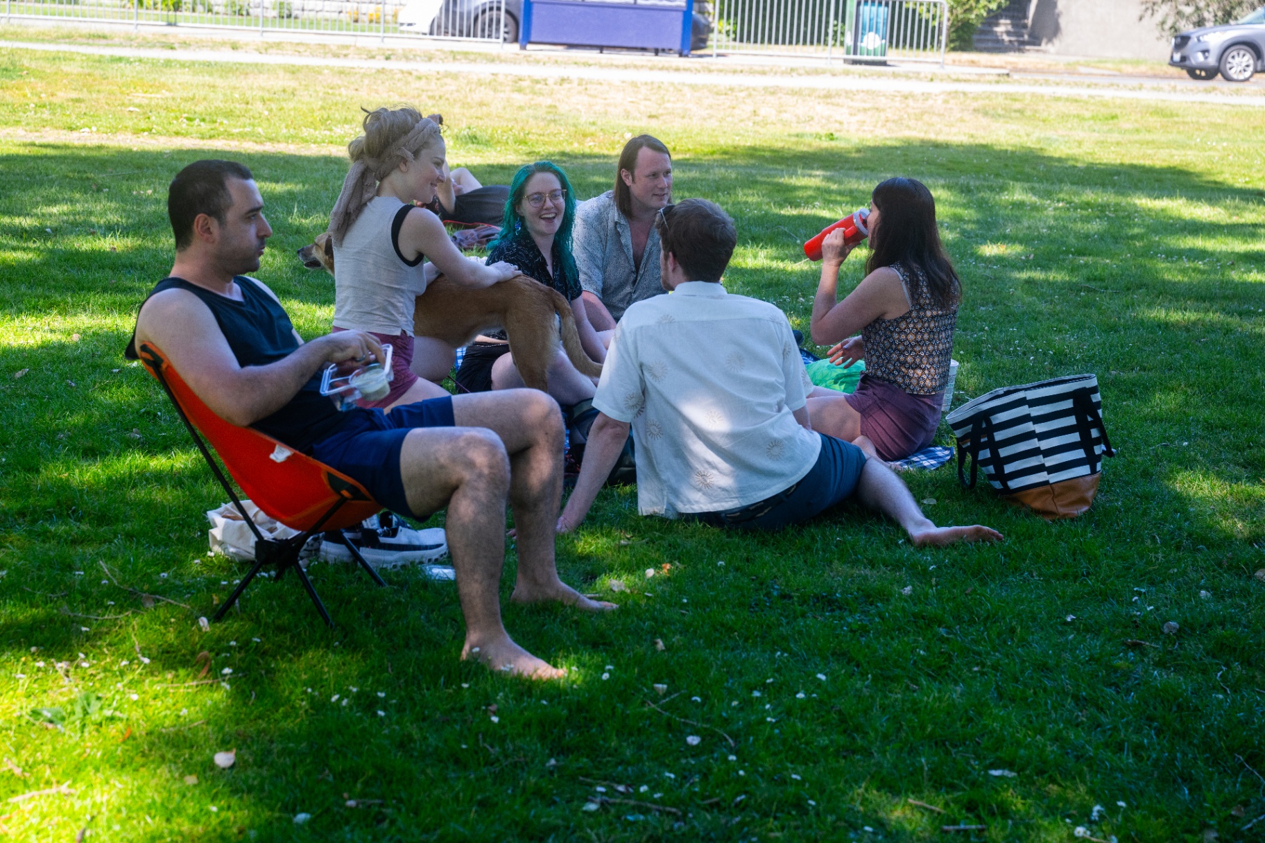 Community hanging out on the grass between dances